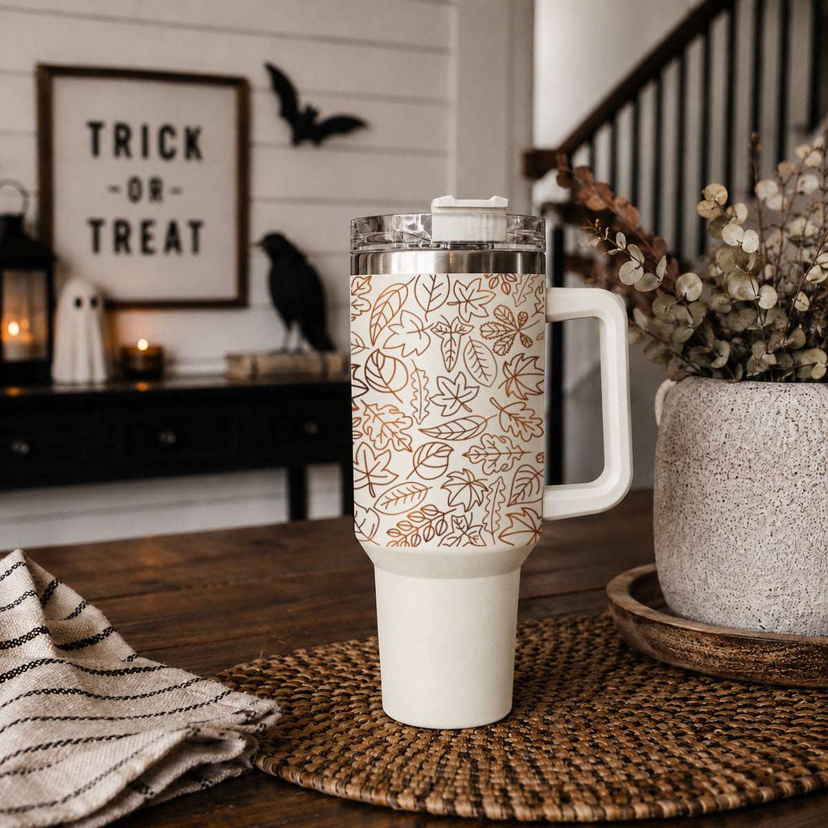 40oz insulated tumbler with clear lid, white base, and orange leaf pattern