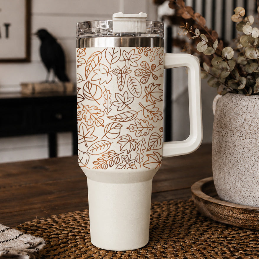 40oz insulated tumbler with clear lid, white base, and orange leaf pattern wrap