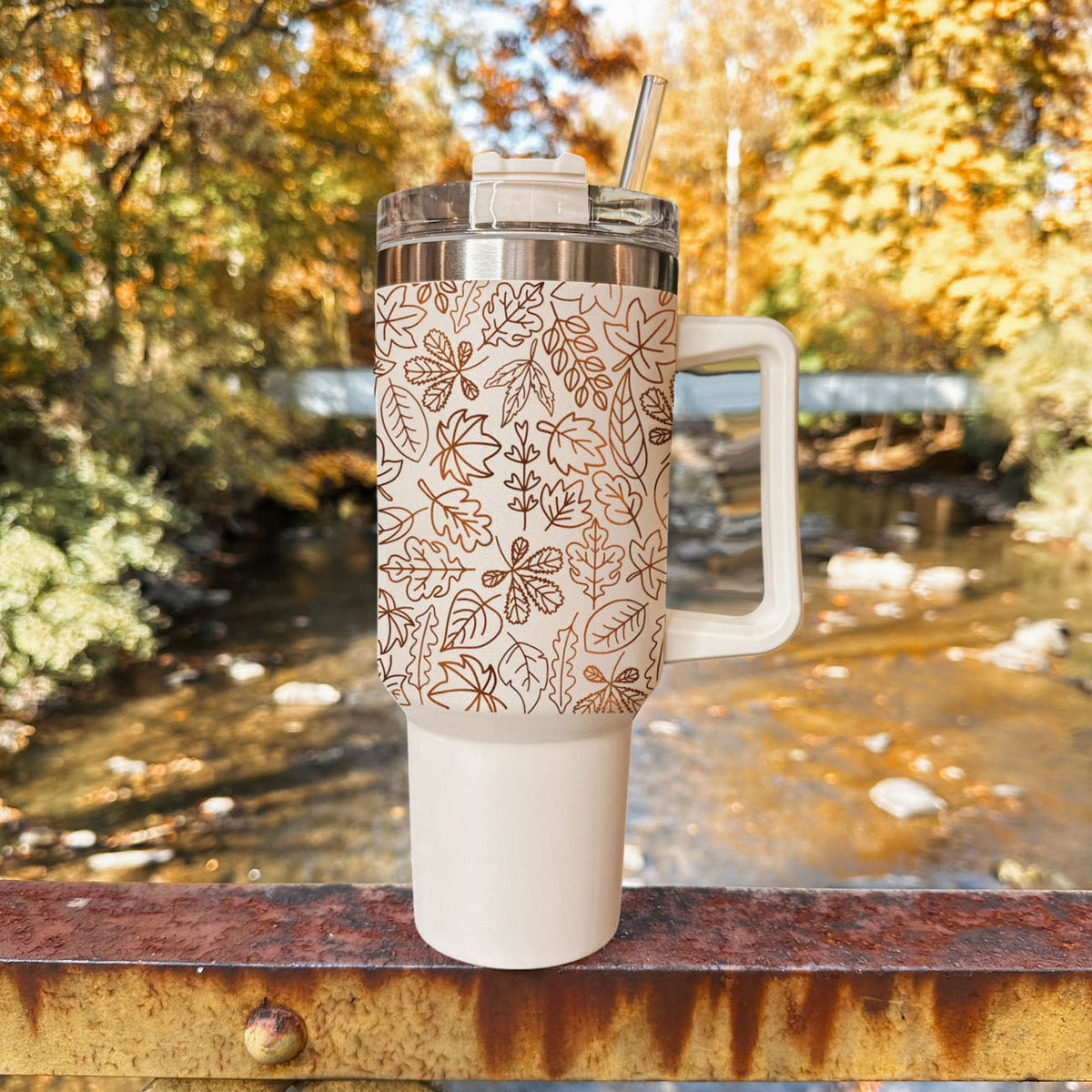 40 oz outdoor tumbler with clear lid and straw, cream base and orange leaf pattern
