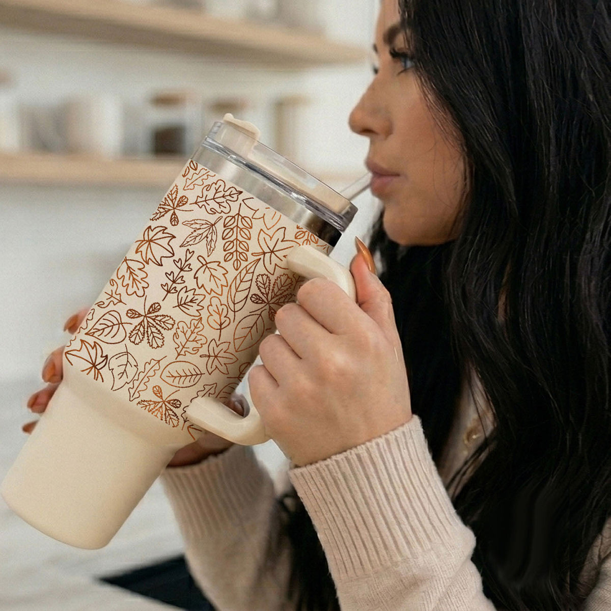40oz cream tumbler with clear lid and straw, orange leaf line design.