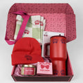 Cherry gift box with red beanie, tote, tumbler, and candle inside