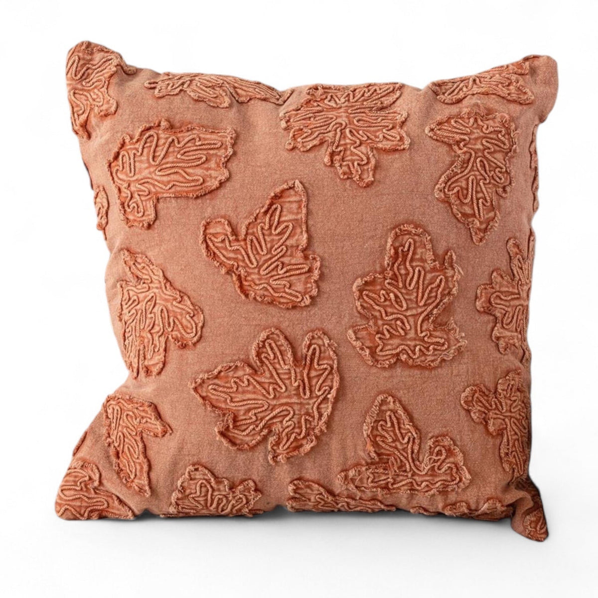 Orange stonewashed throw pillow with raised leaf embroidery, square