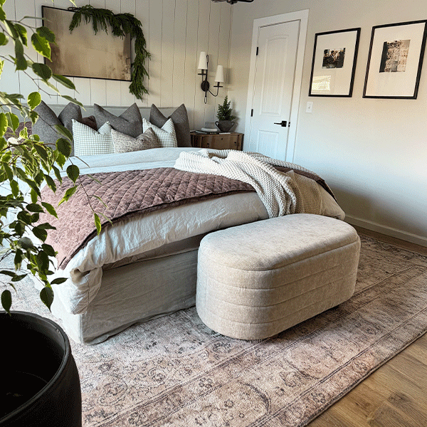 Set of two upholstered nesting storage benches with rounded light beige cushioned tops