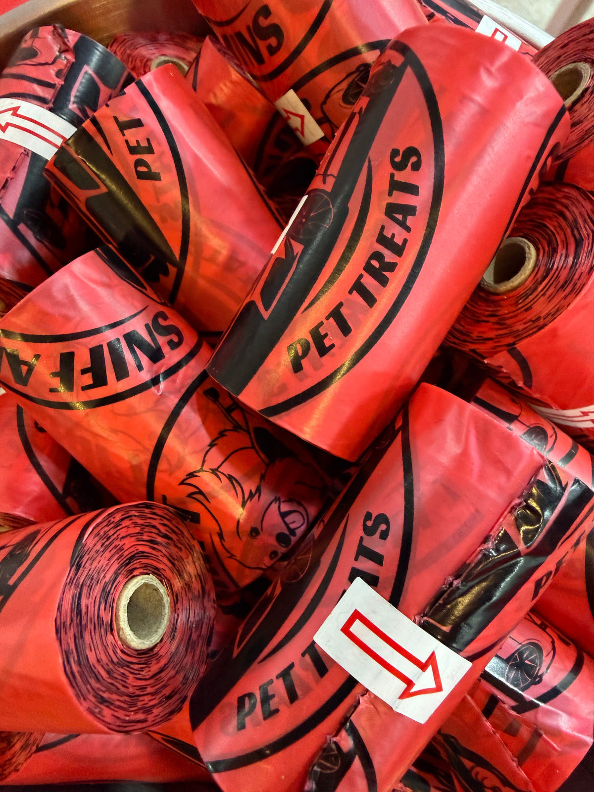 Leak-proof dog poop bags, red rolls with bold PETE print