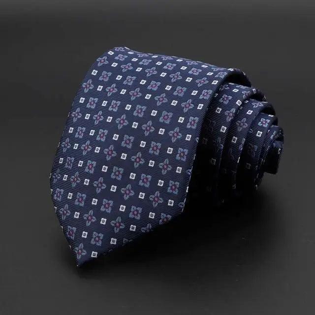 Navy tie with small square and pink floral print