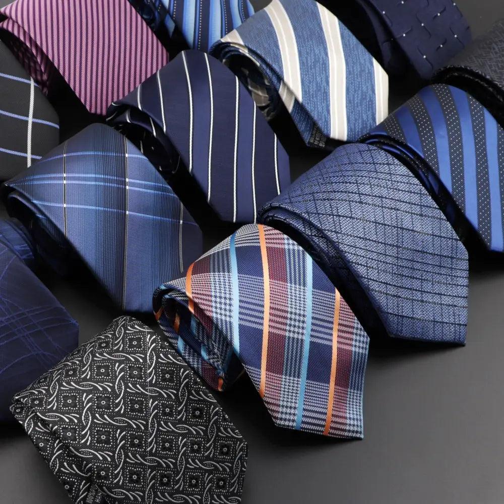 Men's necktie set with mixed blue stripes and dark floral jacquard pattern.