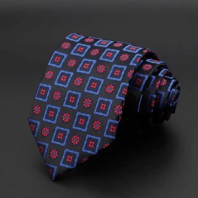 Navy tie with red and pink floral squares pattern
