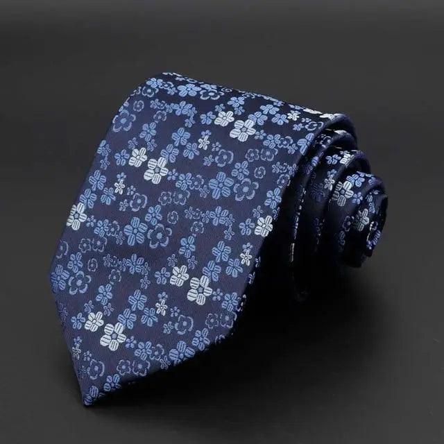 Blue tie with repeating light-blue floral pattern