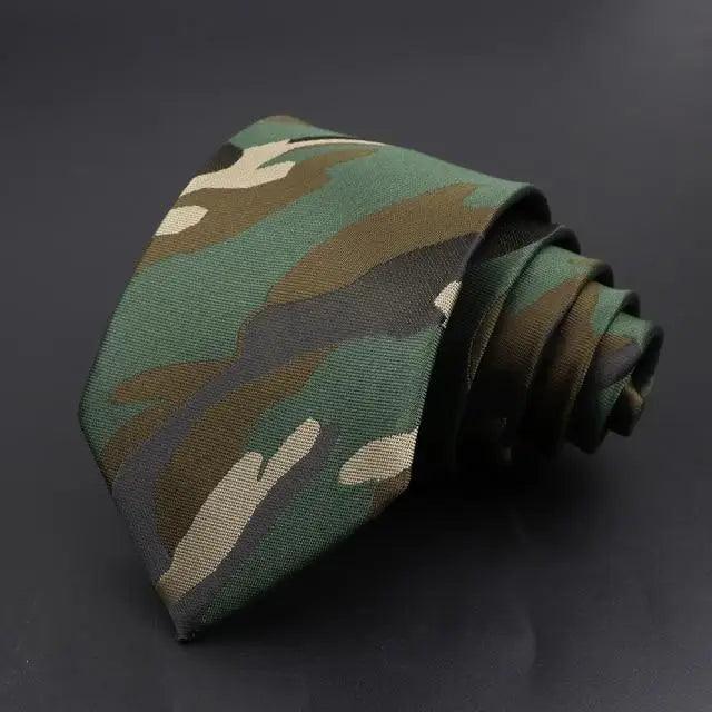 Men's necktie in green with camo-style geometric pattern and woven texture.
