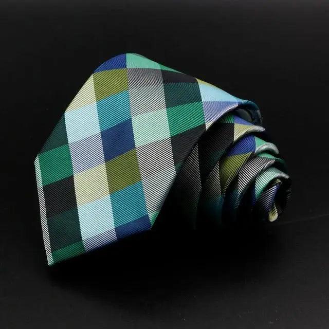 Men's necktie in green with multicolor block plaid squares and woven texture.