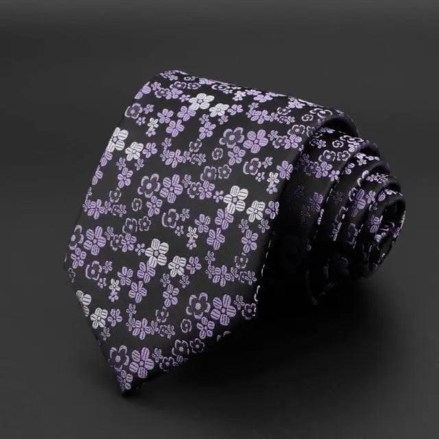 Black tie with scattered lavender floral sprigs