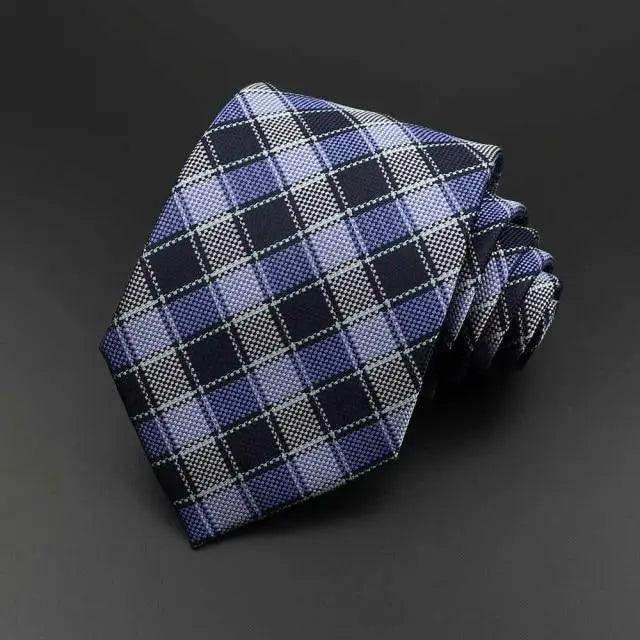 Men's necktie in blue with white grid plaid and folded matching texture.