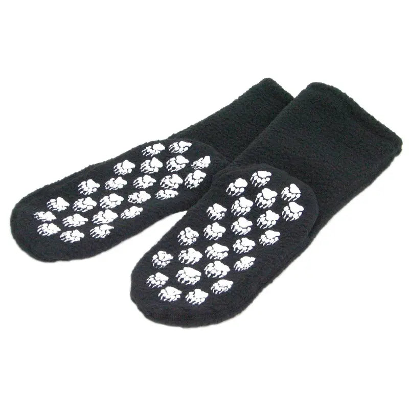Black fleece socks with white skull grip pattern on soles