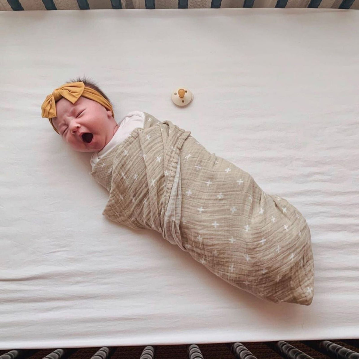 Butterfly swaddle set: beige muslin swaddle with small star pattern and matching headband