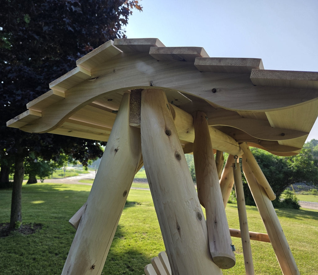 Underside view of wooden porch swing canopy with support beams