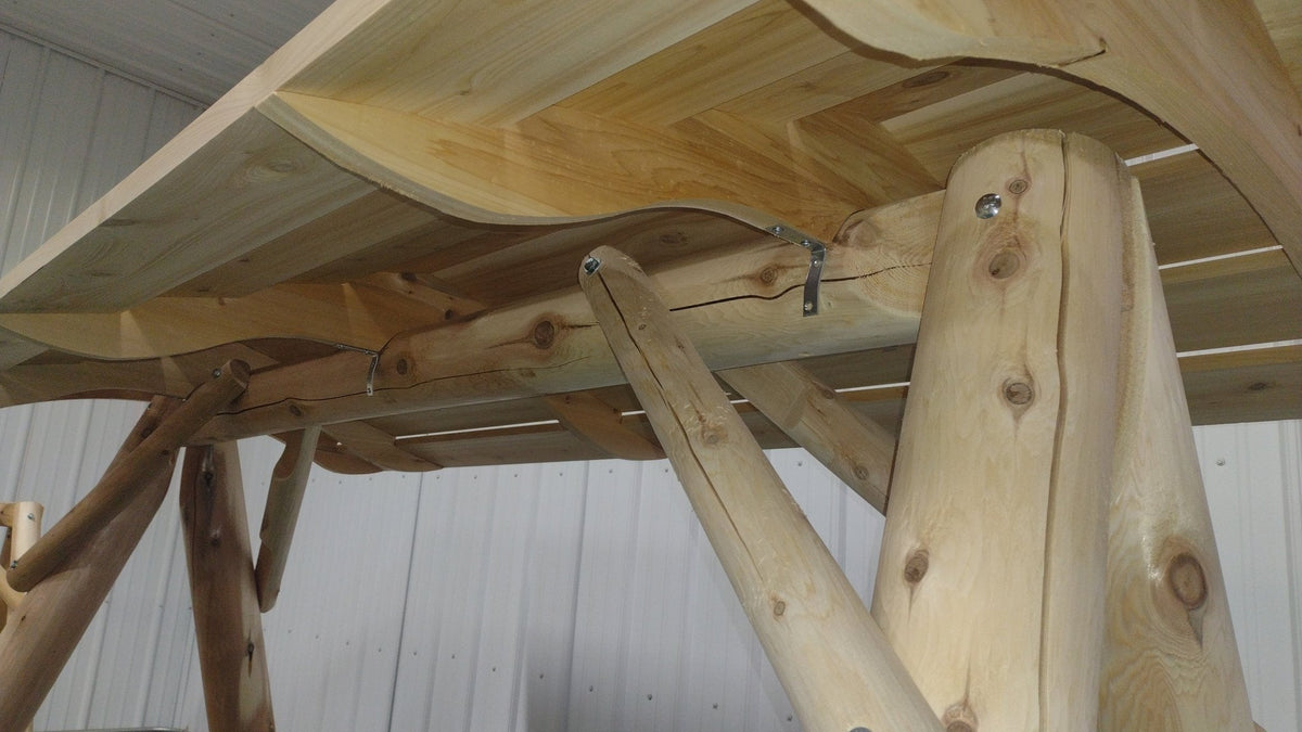 Wooden porch swing frame with light wood canopy slats and mounting hardware