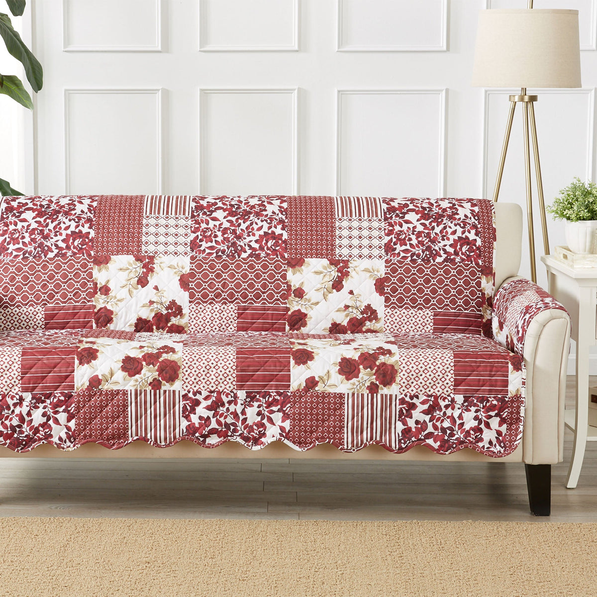 Patchwork reversible sofa protector covering the couch in red and white