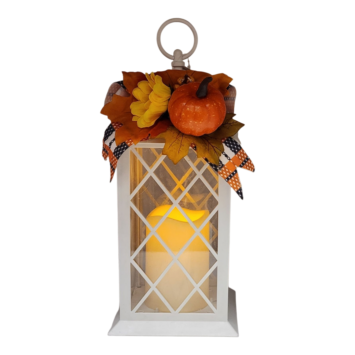 White metal harvest lantern with LED flickering candle, pumpkin and fall flowers on top
