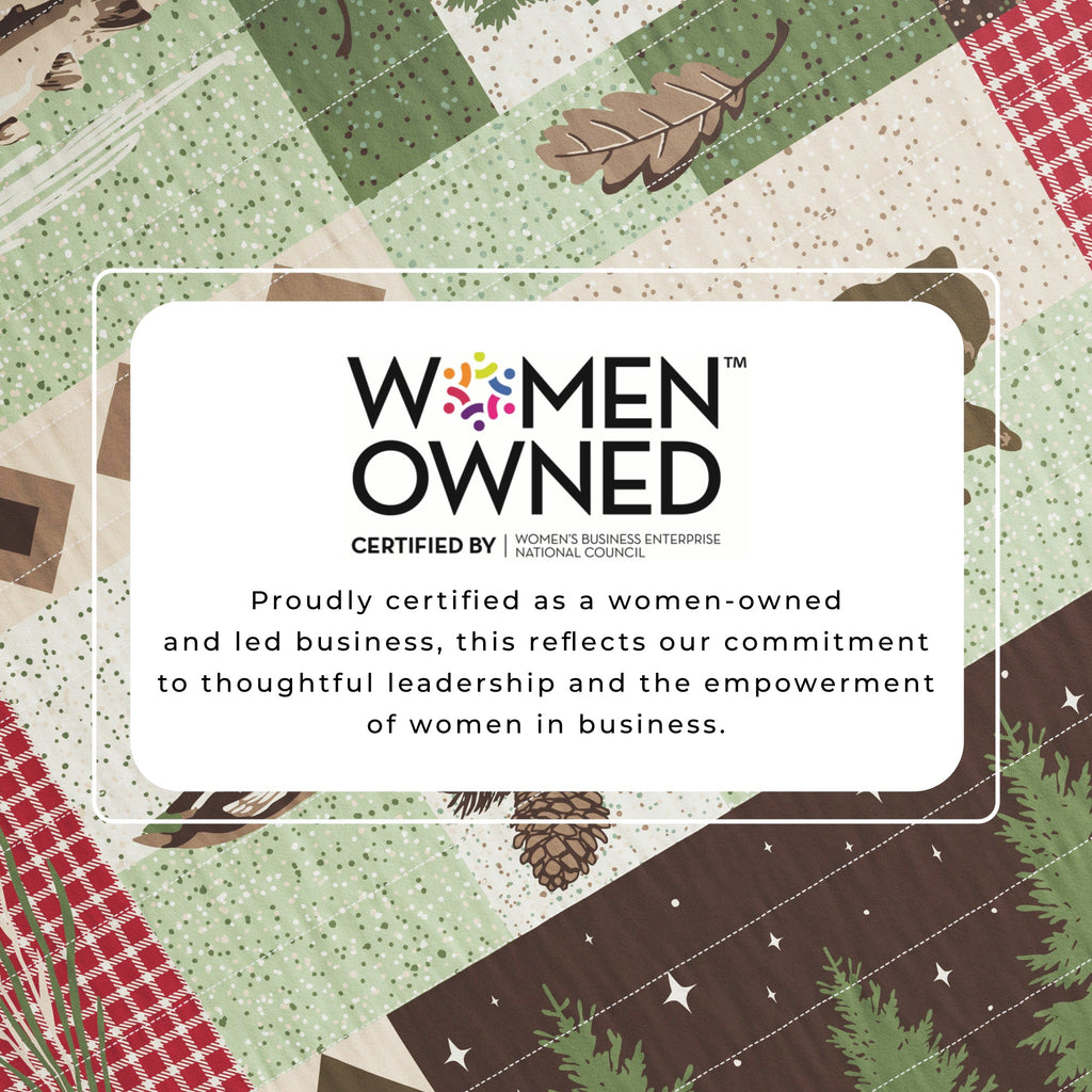 Reversible lodge quilt with green and brown plaid patchwork and women-owned badge