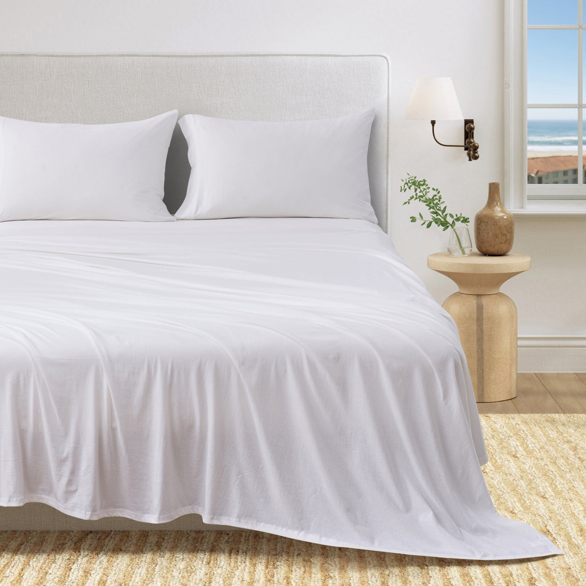 White organic jersey knit sheet set with two pillowcases and fitted sheet