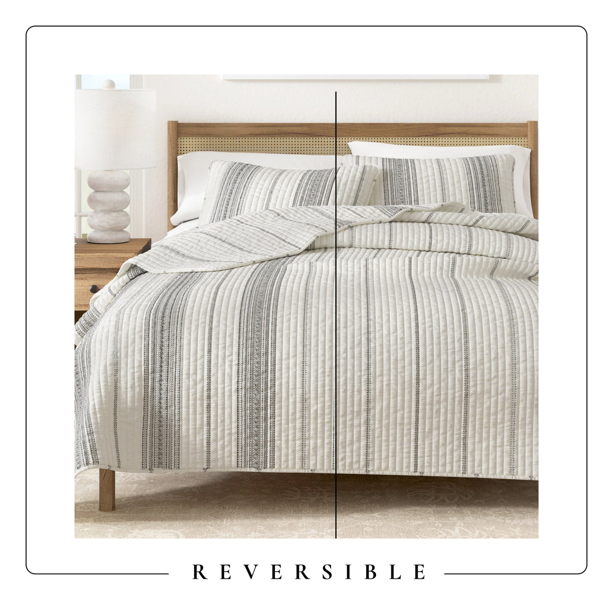 Stripe quilt on a bed with matching pillows, cream and dark grey vertical bands