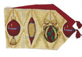 Gold tapestry table runner with red, green Christmas ornament prints and red fringe