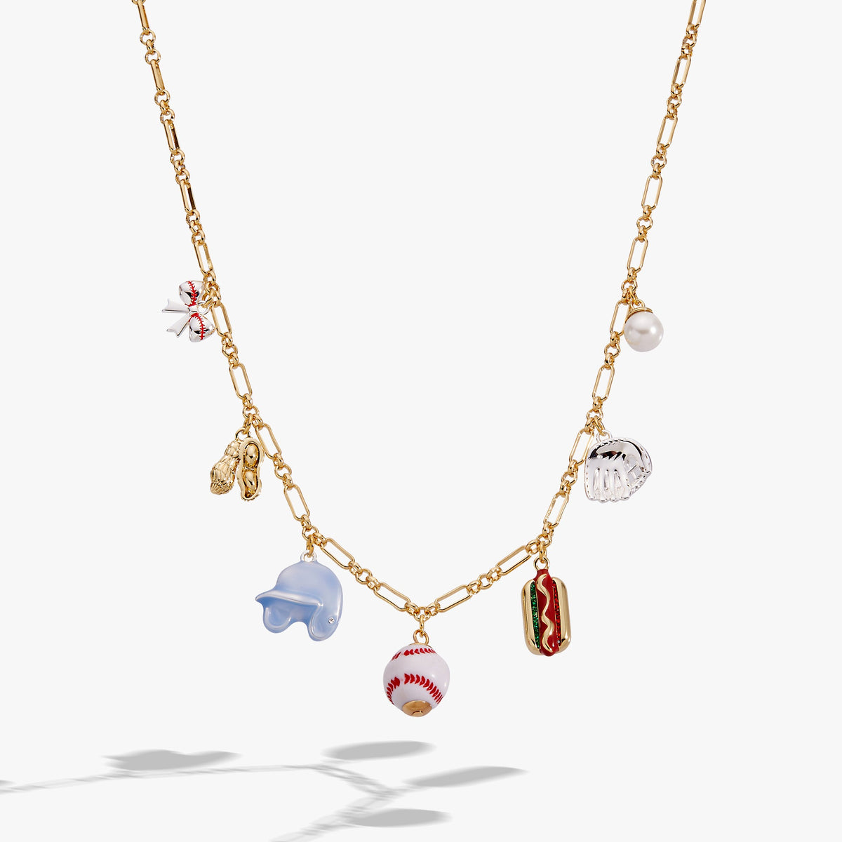 Two-tone gold necklace with baseball, hot dog, pearl, and blue hand-shaped charms