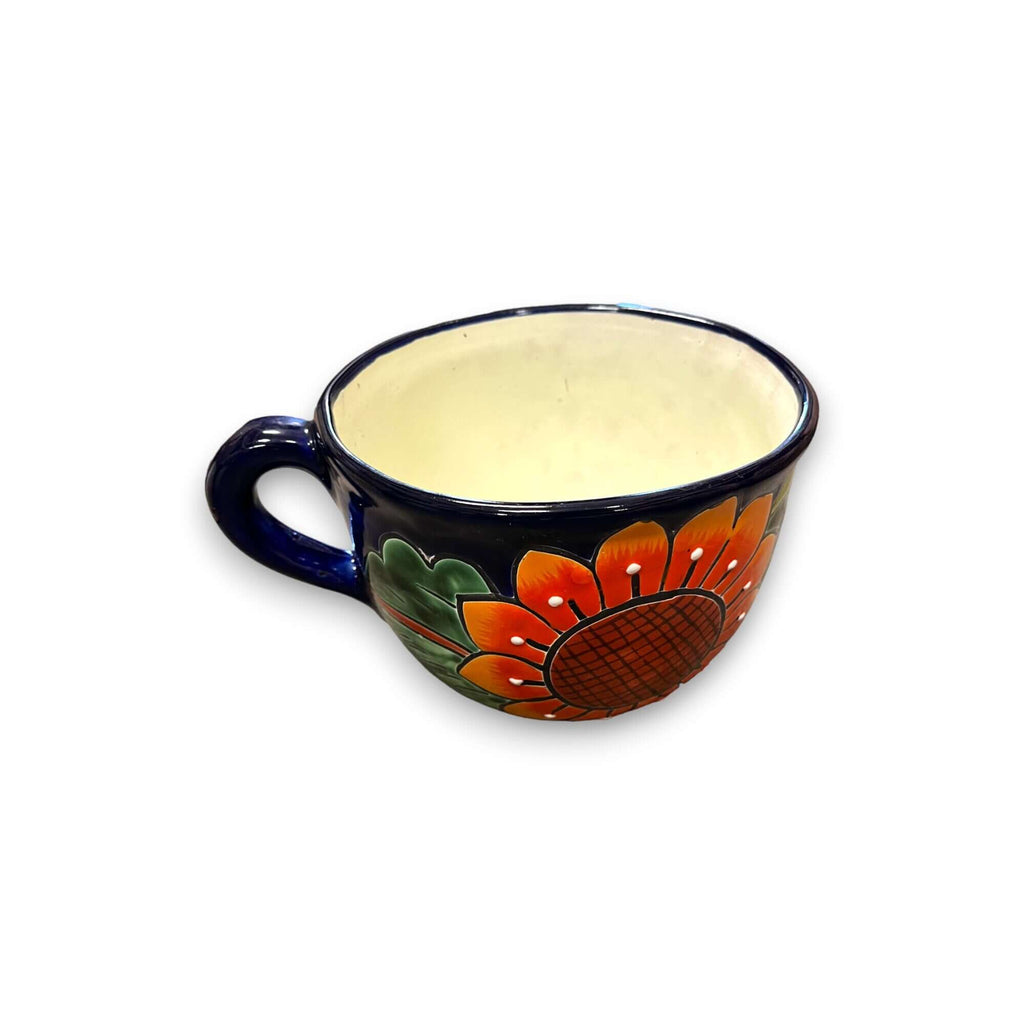 Hand-painted ceramic tea cup planter with dark blue handle and orange floral design
