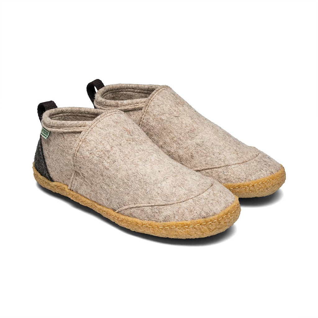 Beige felt slip-on shoes with tan rubber sole and black collar trim