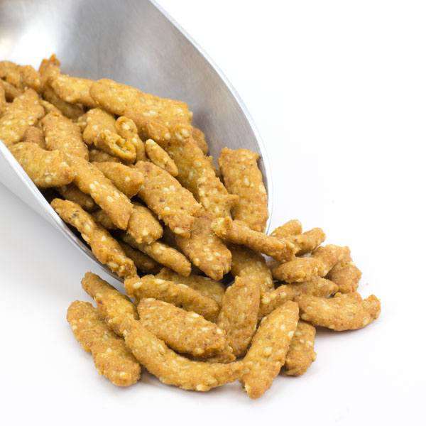 Sesame sticks in a bowl, oat bran coated and seasoned