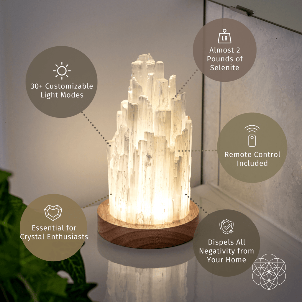 Selenite crystal lamp with glowing tower, round wooden base, remote control shown