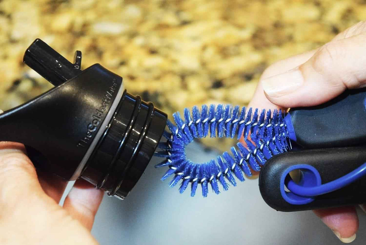 Blue bottle-cleaning brush heads with spiral bristles on a black handle tool