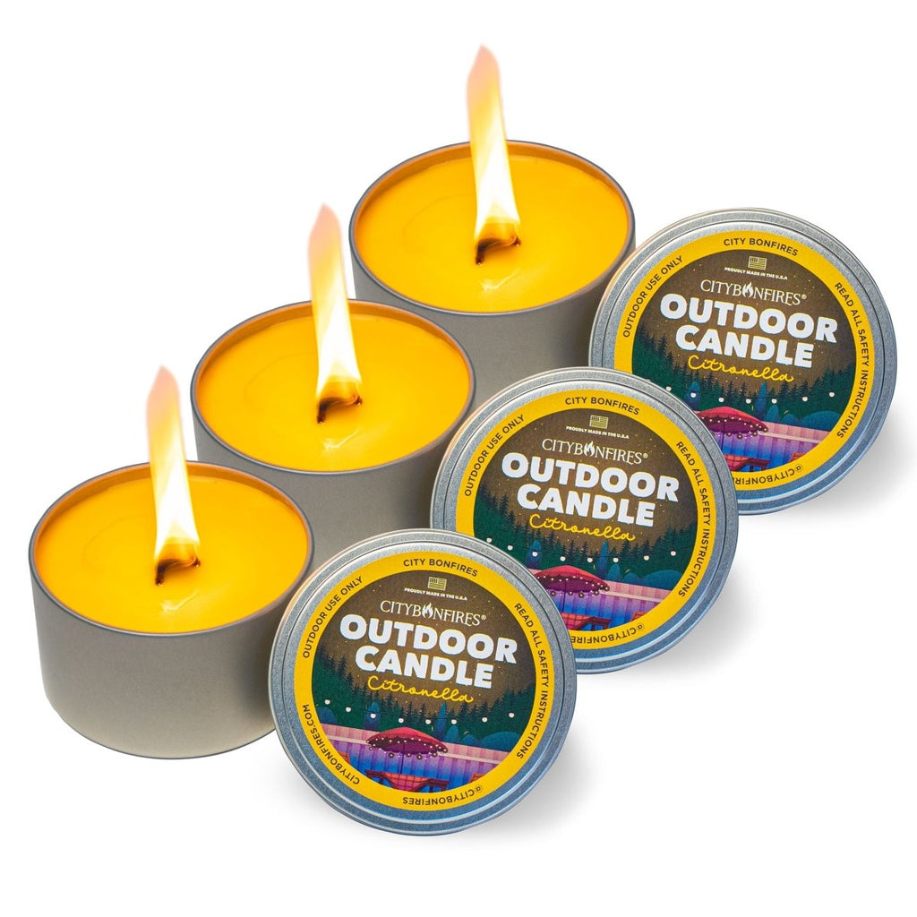 Outdoor citronella candles with multiple lit flames and metal tins with lids