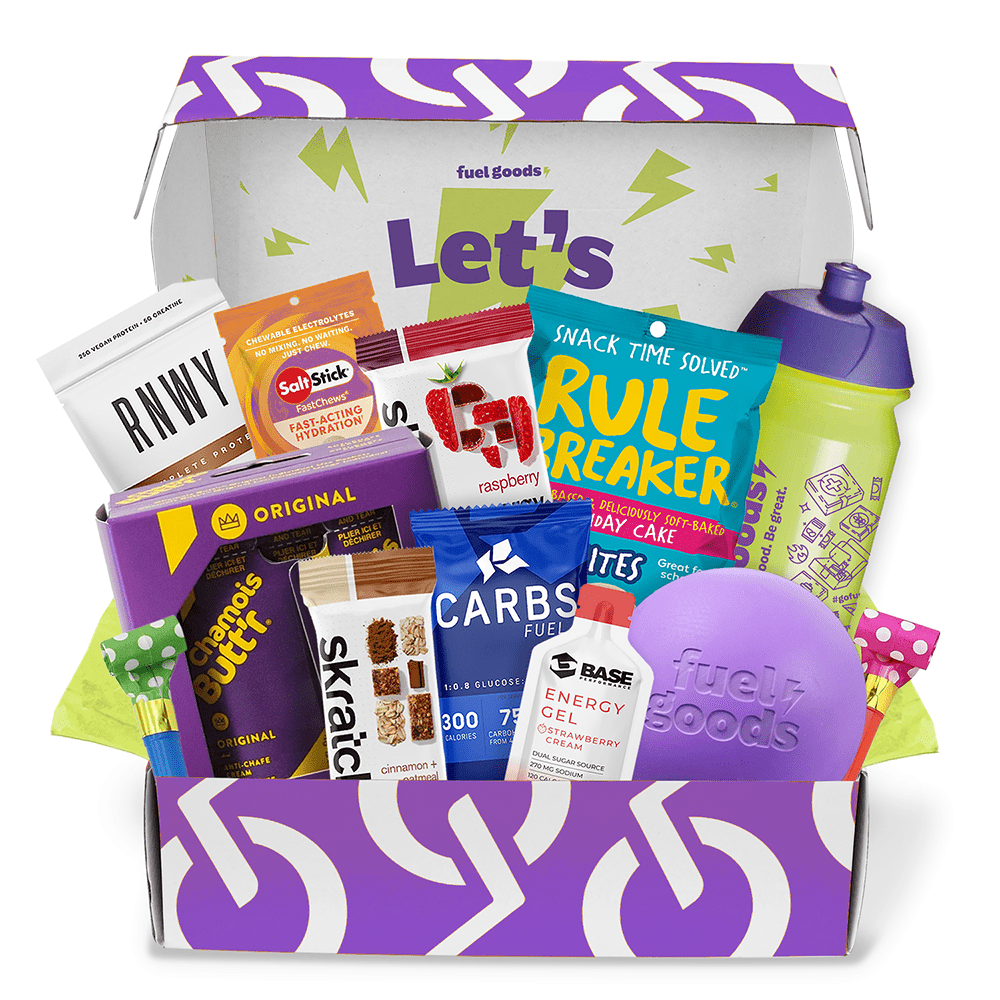 Open purple snack box with colorful packaged foods and branded items