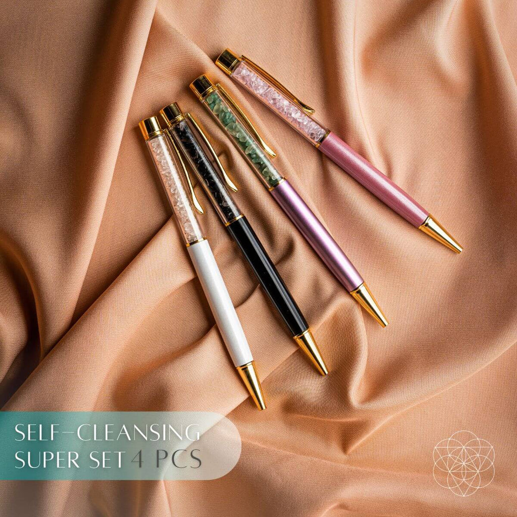 Self-cleansing crystal pen set with four pens in white, black, pink, and purple tones