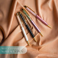 Self-cleansing crystal pen set with four pens in white, black, pink, and purple tones
