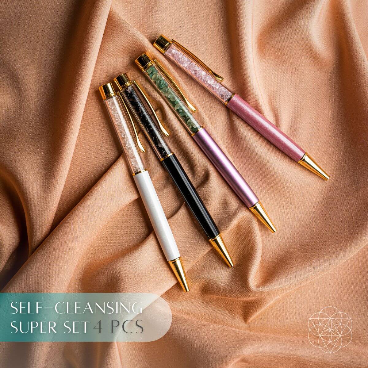 Self-cleansing crystal pen set with four pens in white, black, pink, and purple tones