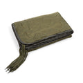 Woobie blanket in ranger green, folded stack with hanging tie cords