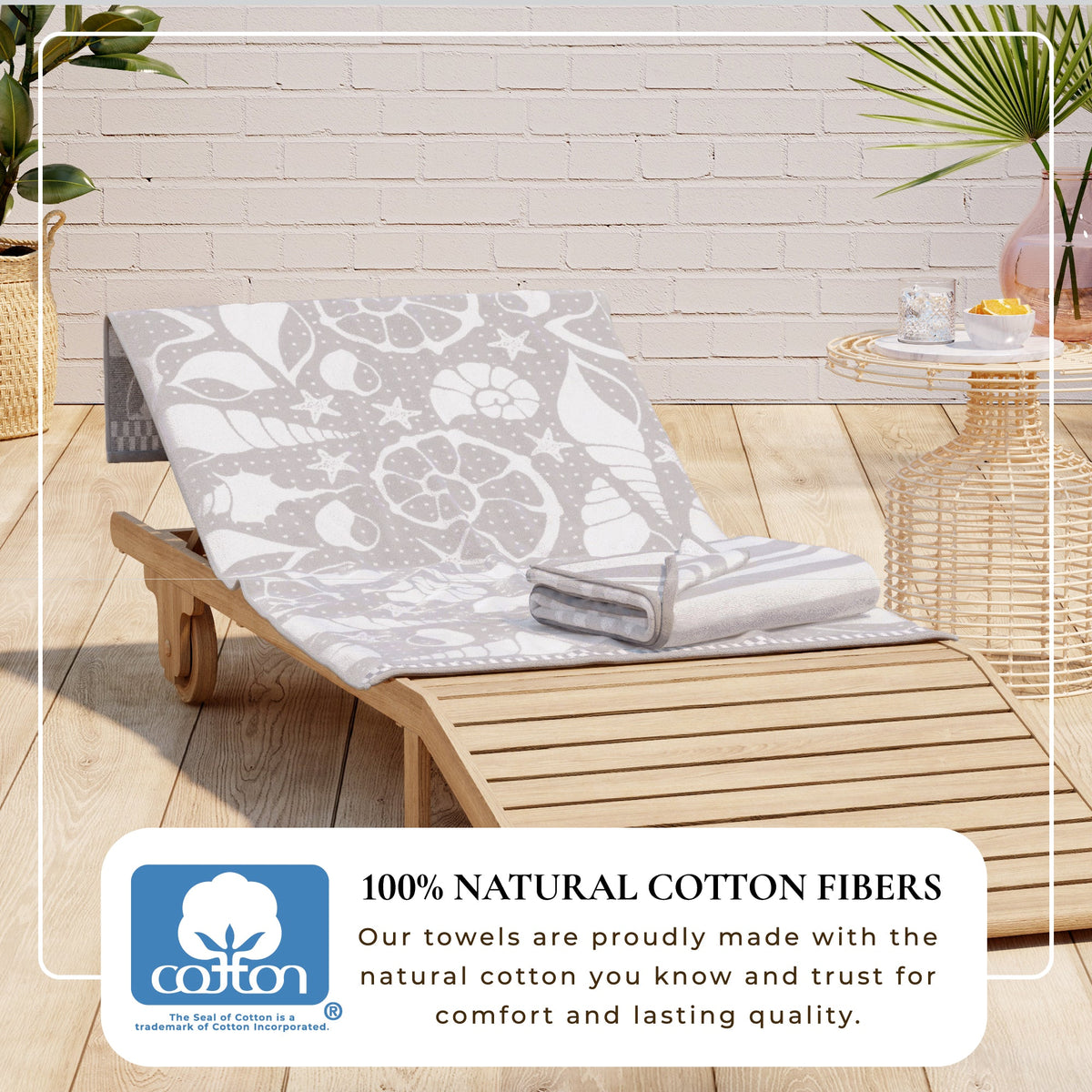 Gray cotton velour beach towel with white nature-inspired pattern