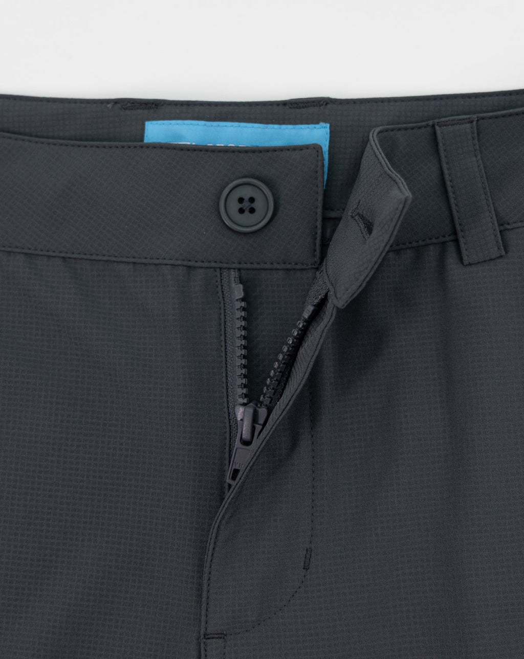 Dark gray sportswear shorts close-up waistband with button and front zipper