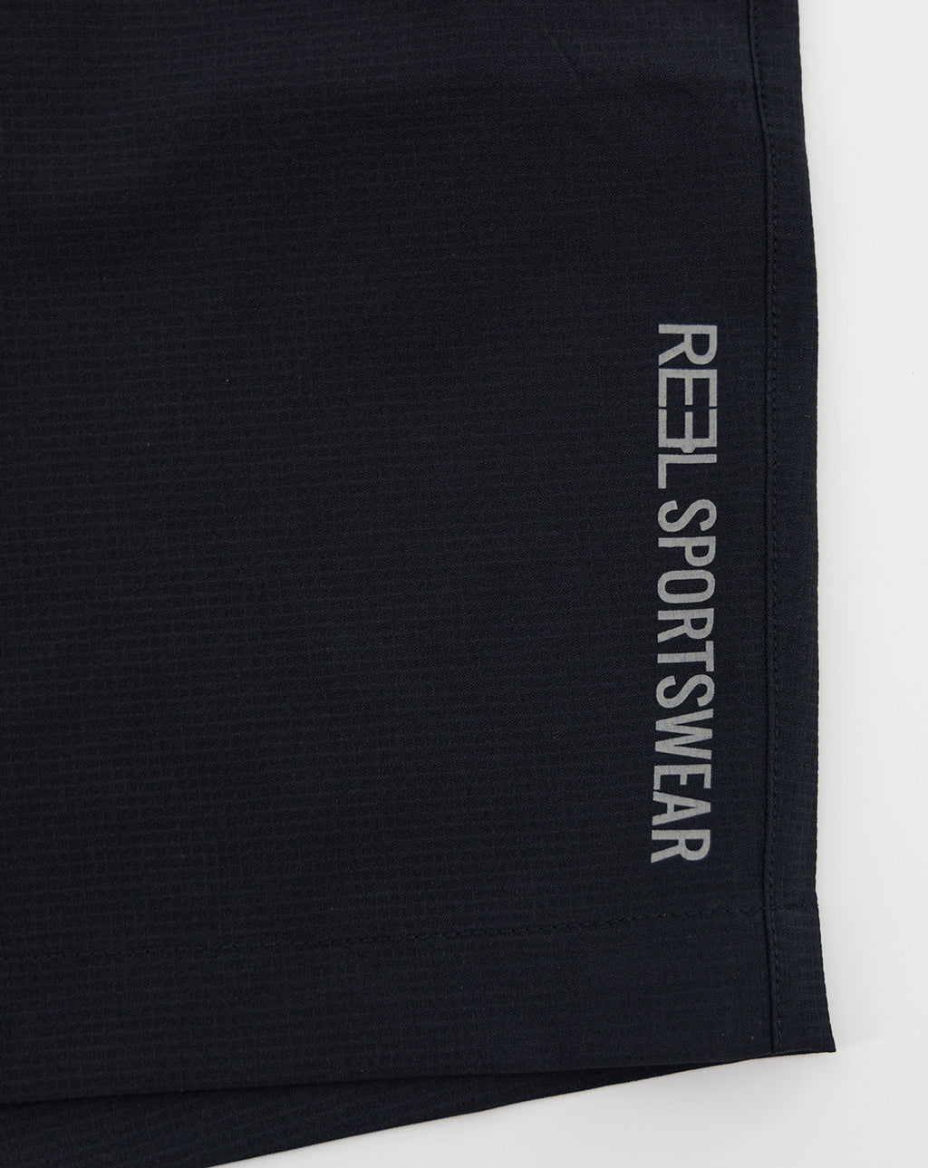 Dark sportswear shorts with REL Sportswear vertical logo on side hem