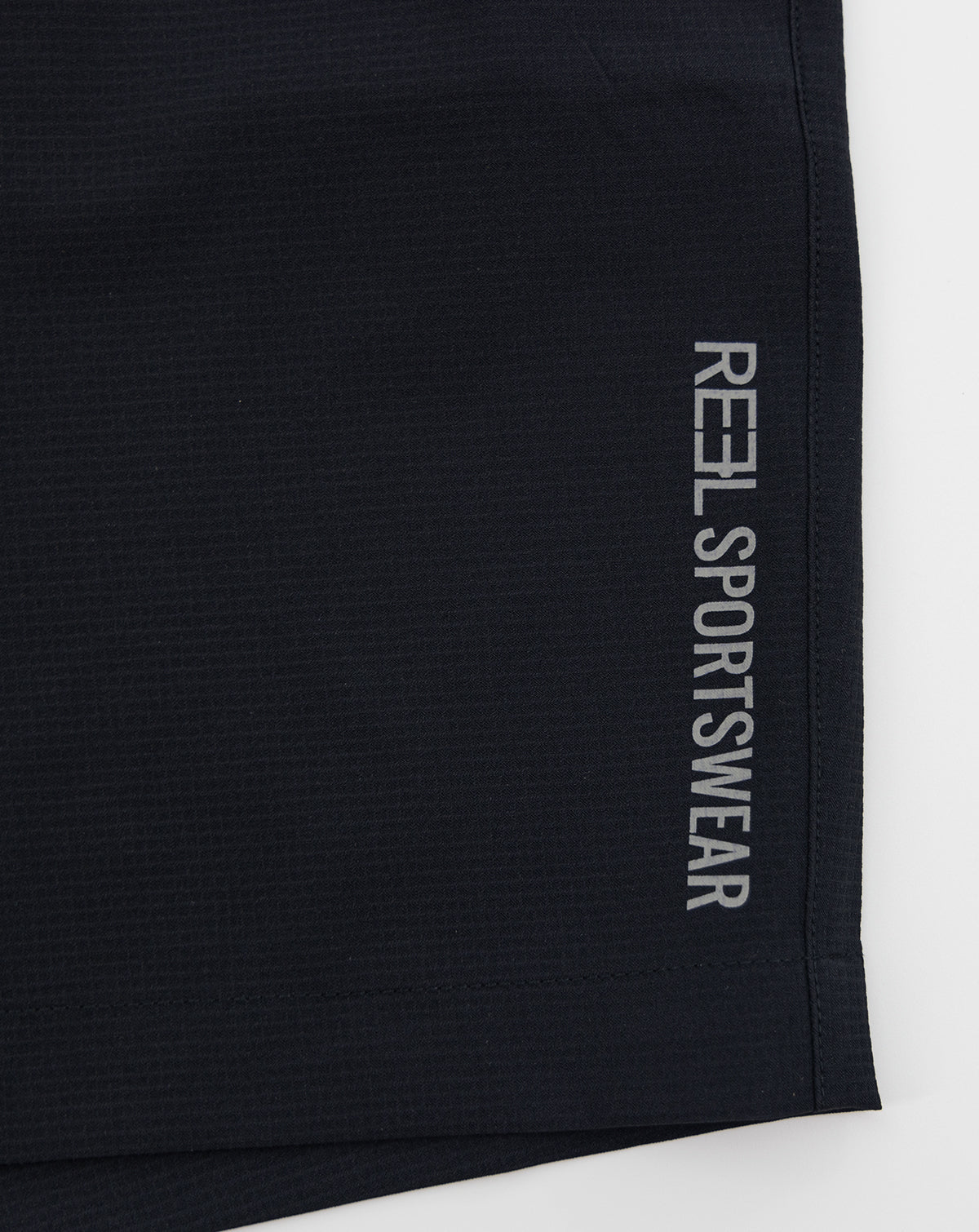 Dark sportswear shorts with REL Sportswear vertical logo on side hem