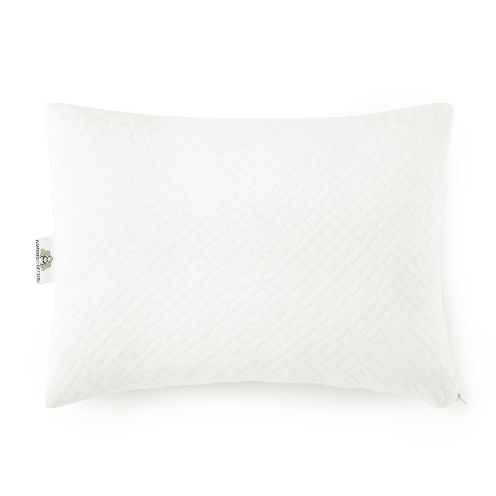 White toddler pillow with quilted cover and small fabric tag on corner