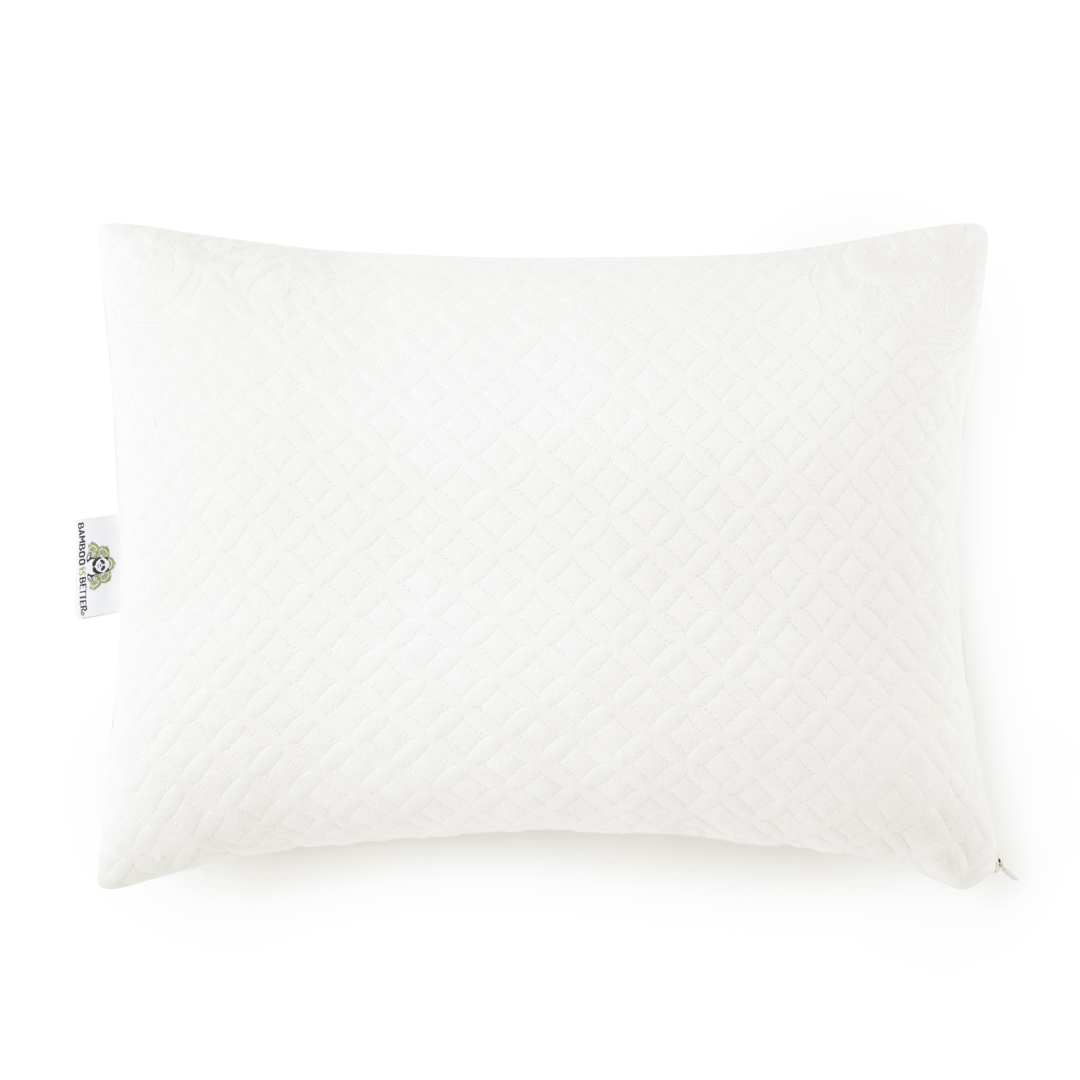 White toddler pillow with quilted cover and small fabric tag on corner