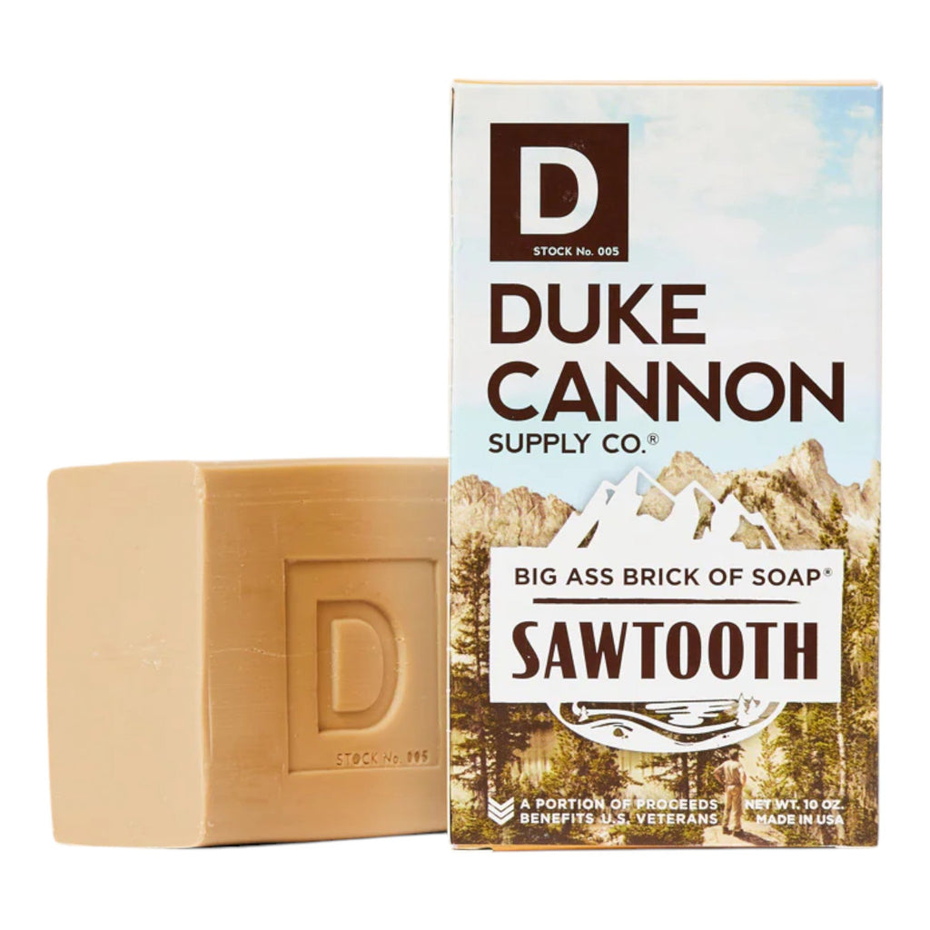 Beige soap brick with stamped D emblem and Sawtooth Duke Cannon supply box