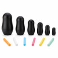 Six nested black chalkboard dolls with six colored chalk sticks