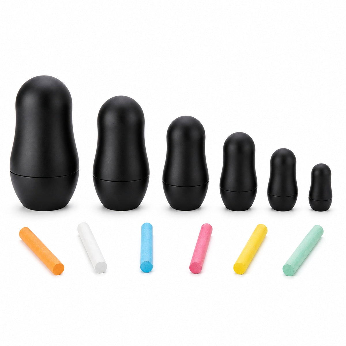 Six nested black chalkboard dolls with six colored chalk sticks