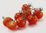 Red cherry tomatoes with stems, including one halved