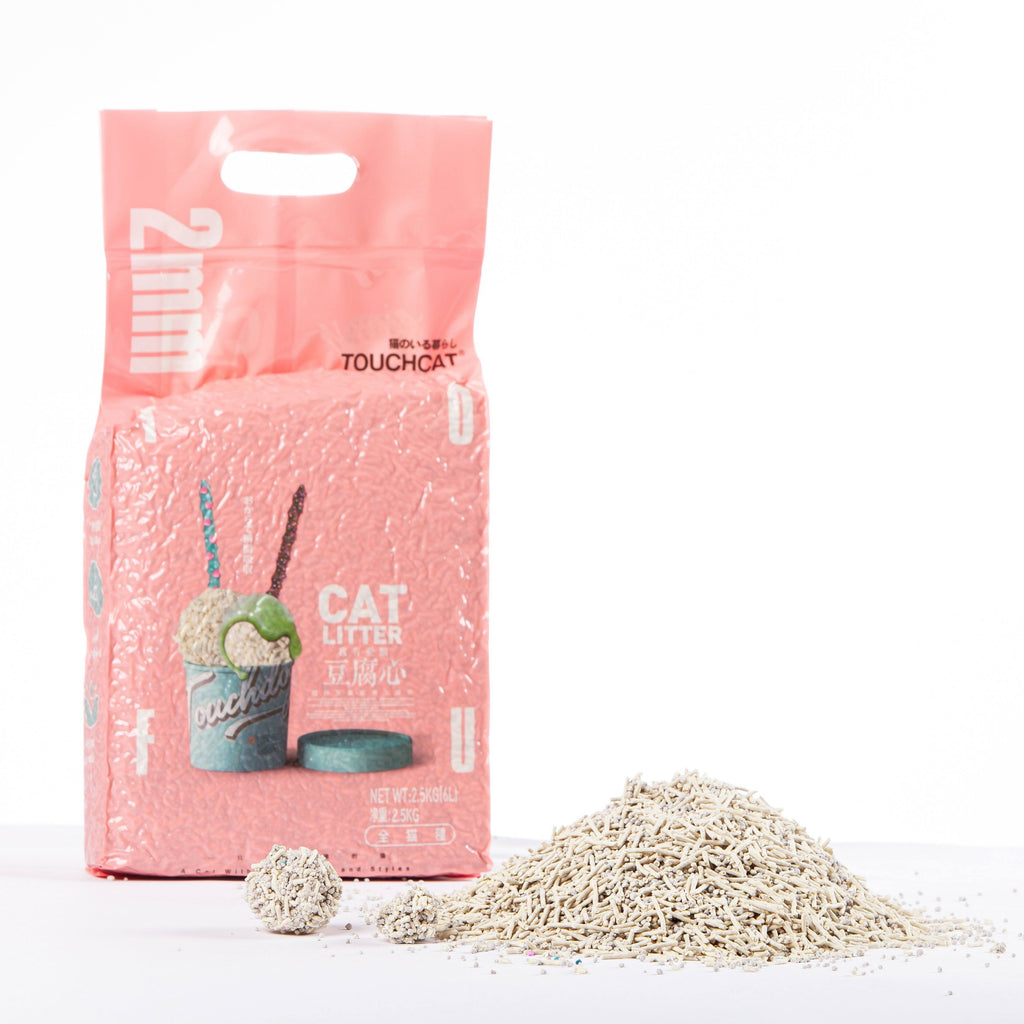 Touchcat cat litter bag beside a mound of pale pellet litter