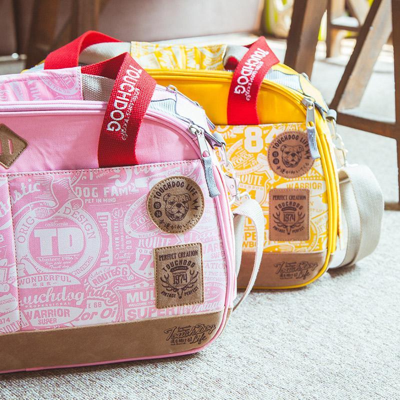 Touchdog pink and yellow printed airline pet carriers with zip tops and shoulder straps